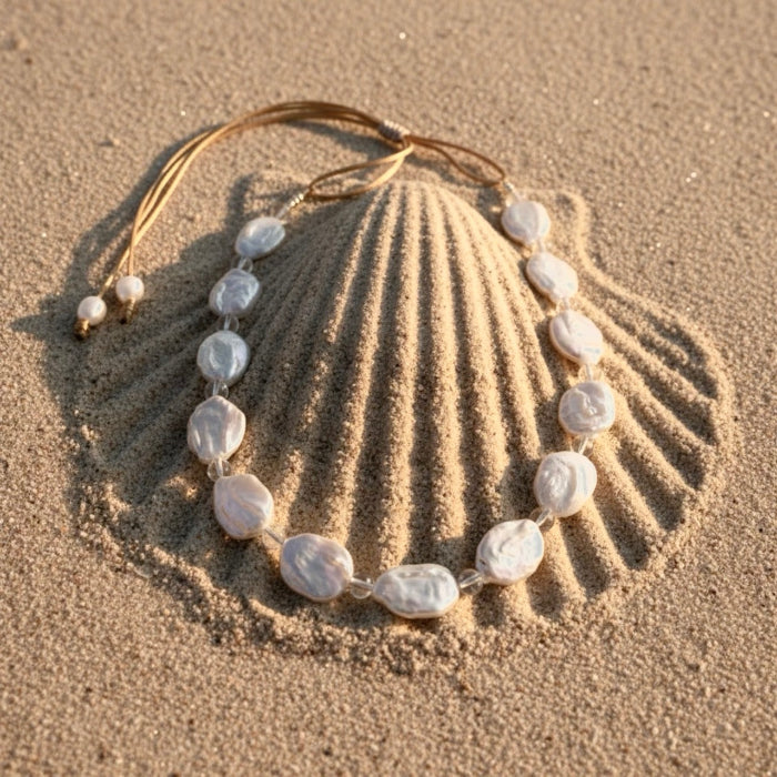 Seafoam Mist pairs clear quartz beads known for clarity, healing, and amplifying positive energy, with the unique beauty of baroque coin pearls, symbol of prosperity.