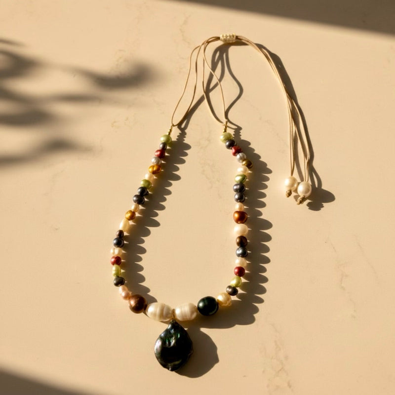 Isla Pearls: OOAK nylon adjustable necklace with green, white, copper freshwater pearls with a baroque green-blueish pendant. 