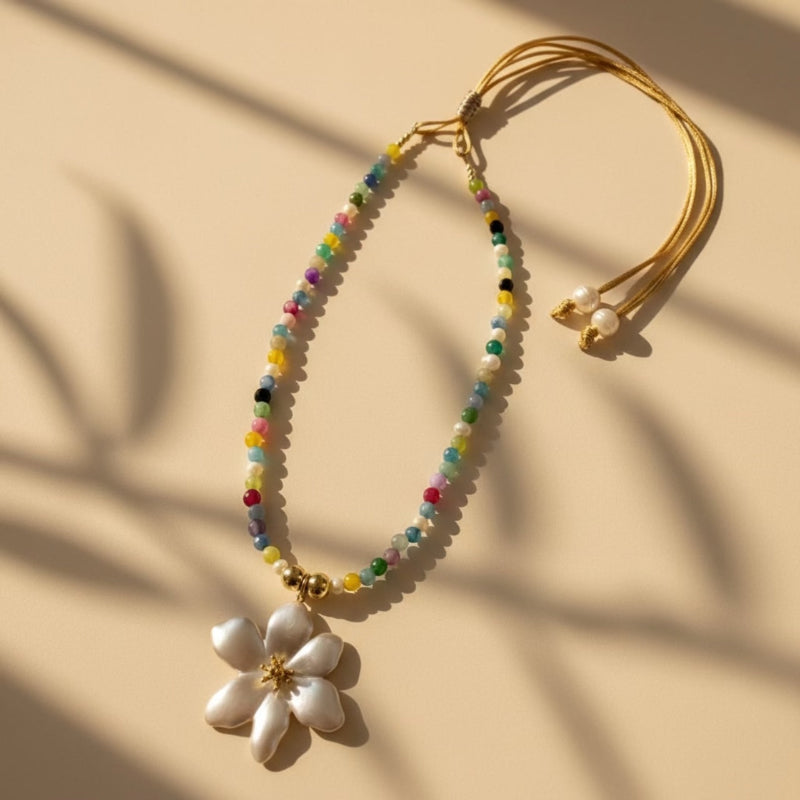 Handcrafted adjustable necklace with jade stones, freshwater pearls and a silver-golden tone stainless steel hibiscus flower pendant.