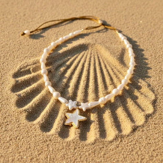 Mother of Pearl teardrop adjustable necklace with stainless steel sea star surrounded by 2 freshwater star pearls.