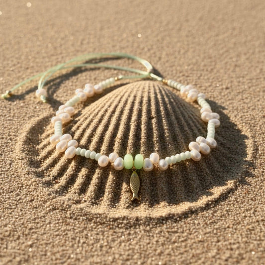A tranquil, ocean-inspired necklace featuring mint-green shell rondelles and mint-green stones with luminous freshwater pearls. 