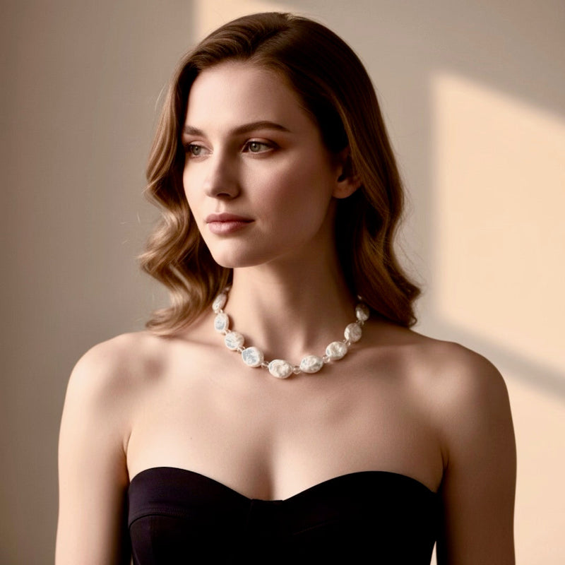 Seafoam Mist pairs clear quartz beads known for clarity, healing, and amplifying positive energy, with the unique beauty of baroque coin pearls, symbol of prosperity.