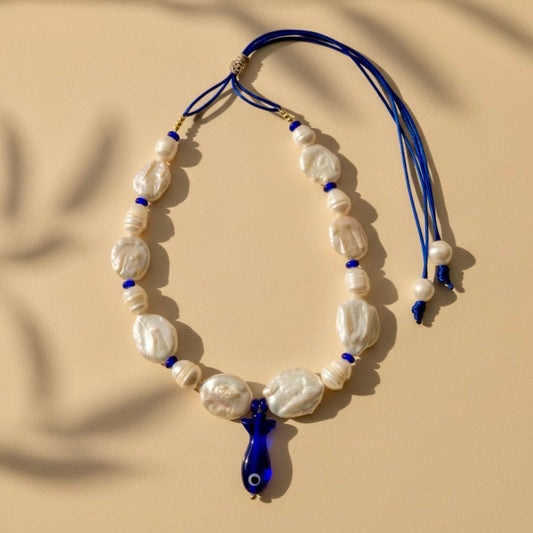 Bluefin Tides adjustable necklace, where each baroque coin pearl and freshwater ringed pearl reflects the beauty of imperfection and authenticity. 