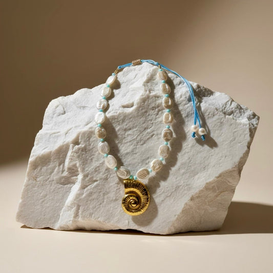 The Tidal Charm adjustable necklace captures the beauty of the ocean. It features baroque crushed coin pearls, each uniquely formed to celebrate the individuality of beauty. 