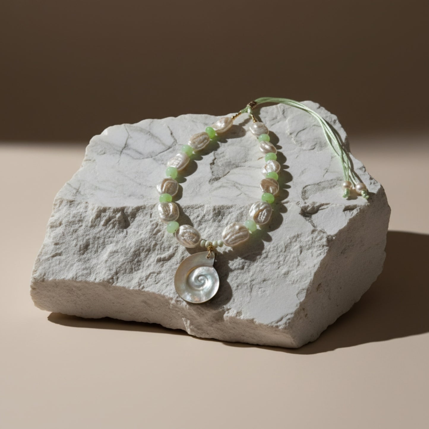 Ocean Muse – Mist Green evokes the tranquil hush of seafoam drifting along a quiet shore. This serene necklace pairs luminous baroque pearls—each one naturally unique—with soft green opal rondelles that shimmer with subtle, misty hues reminiscent of ocean waters at dawn.