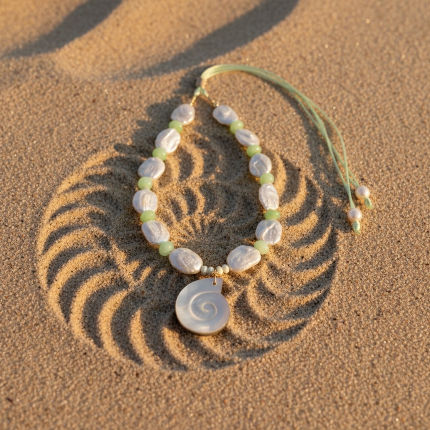 Ocean Muse – Mist Green evokes the tranquil hush of seafoam drifting along a quiet shore. This serene necklace pairs luminous baroque pearls—each one naturally unique—with soft green opal rondelles that shimmer with subtle, misty hues reminiscent of ocean waters at dawn.
