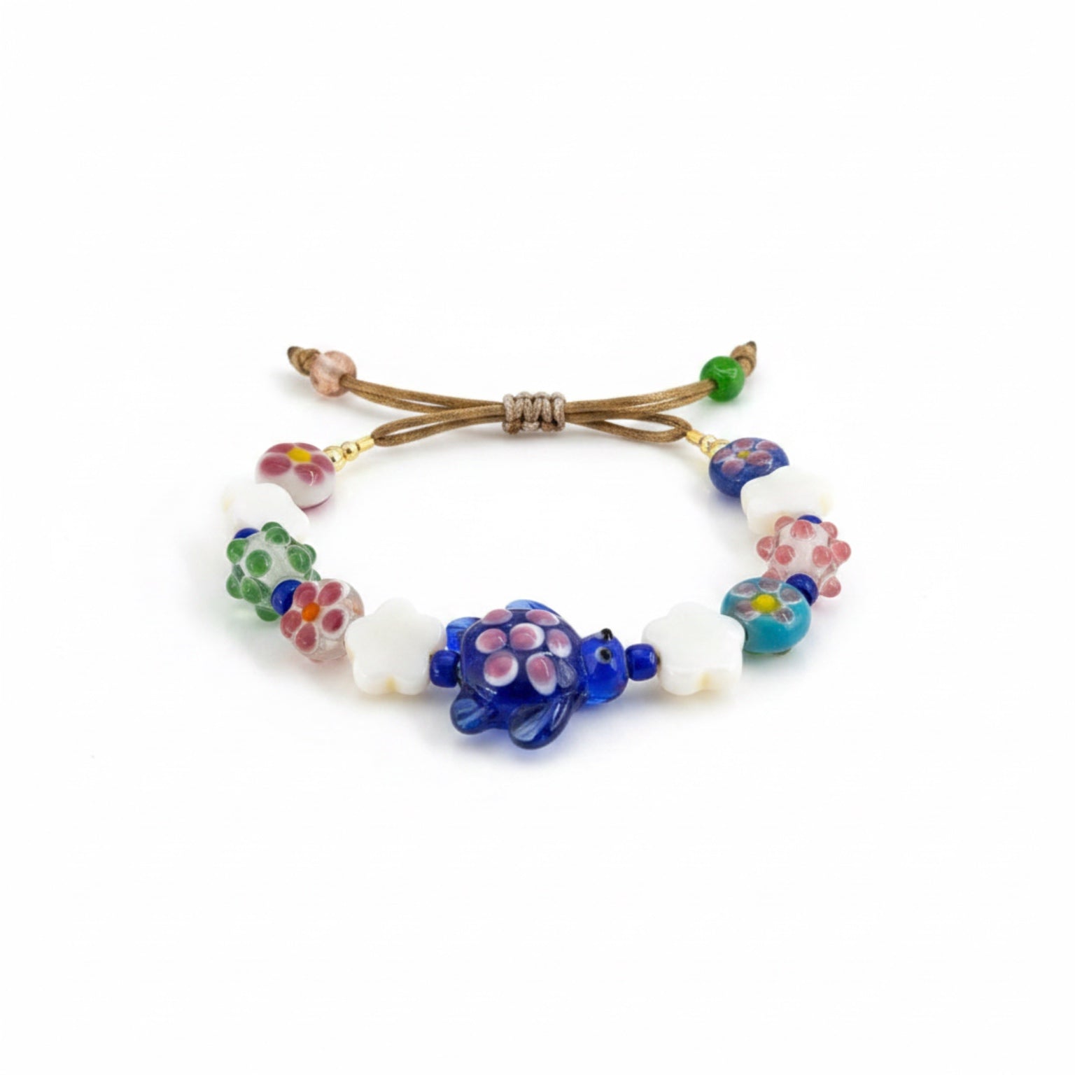 Colorful beaded bracelet with turtle charm on a white background