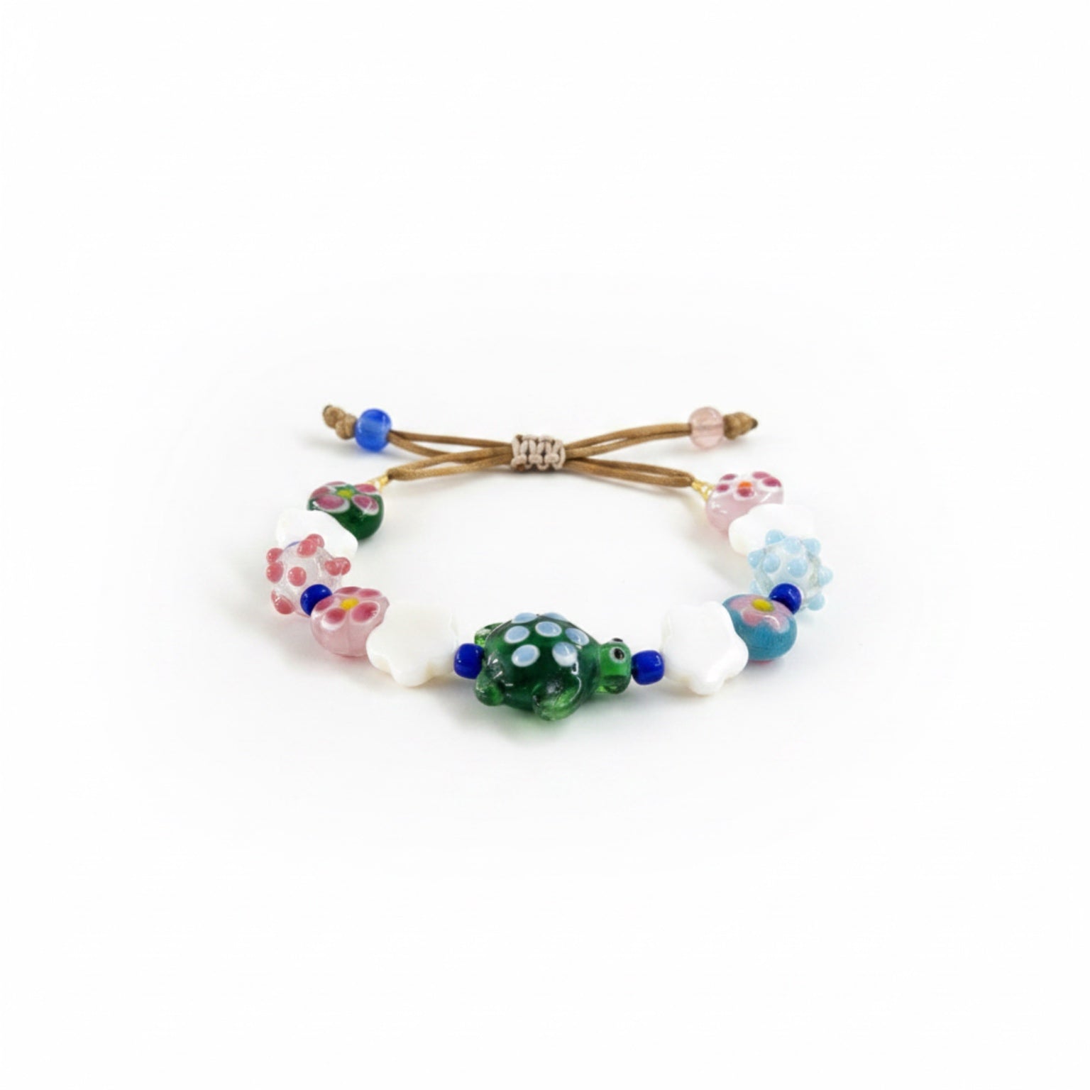 Colorful beaded hair tie on a white background