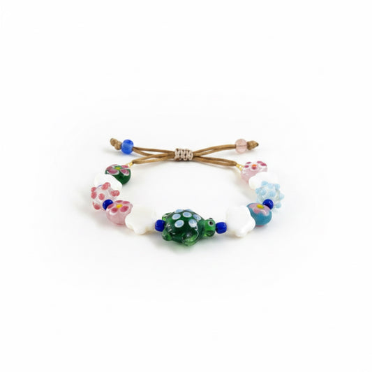 Colorful beaded hair tie on a white background