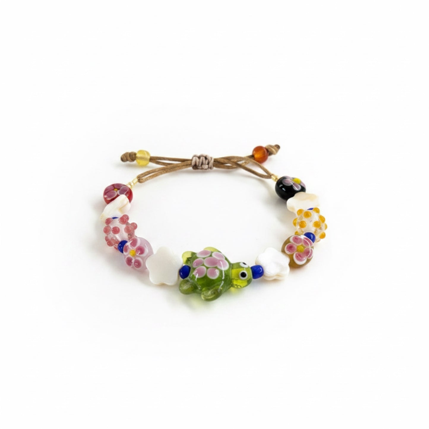 Bracelet with colorful beads and a turtle charm on a white background