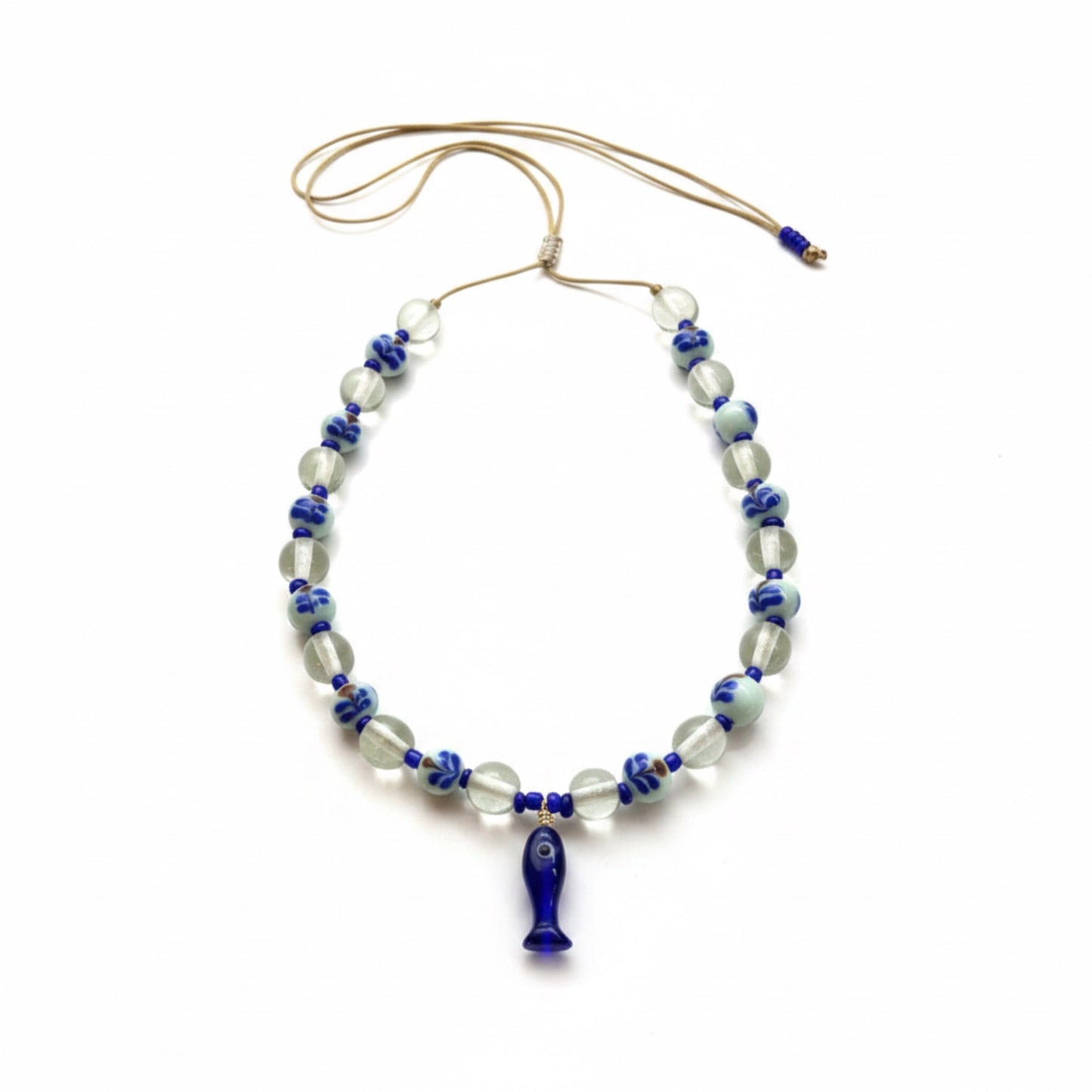 Necklace with blue and clear beads on a white background