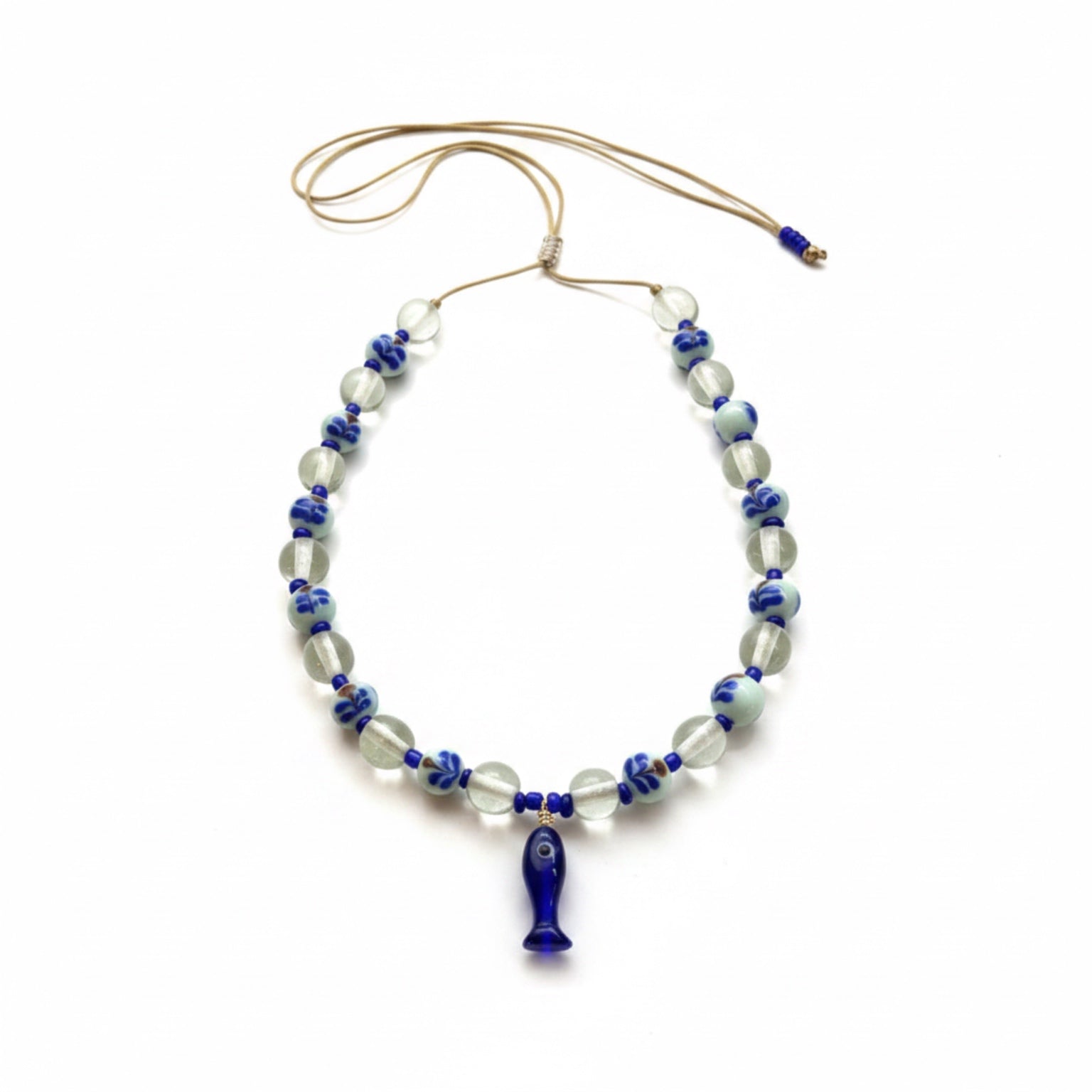 Necklace with blue and clear beads on a white background